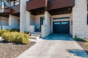 Hamilton (Stoney Creek) townhouse for rent - The front of a building with a black door and a sign that reads "190".