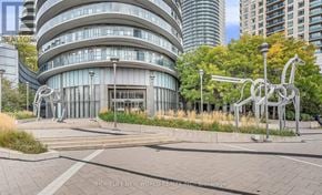 Mississauga (City Centre) condo for rent - A modern building with a sculpture in front of it.