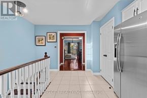 Mississauga (Erindale) townhouse for rent - A kitchen with blue walls and a white refrigerator.