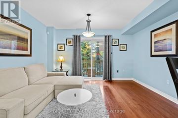 Mississauga (Erindale) townhouse for rent - A living room with a beige couch and a white coffee table.