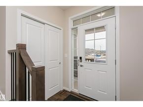 Edmonton apartment for rent - A white door with a glass window is open.