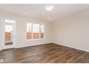 Edmonton apartment for rent - A room with a white door and a window with wooden blinds.