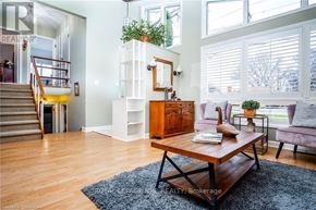 Niagara Falls (Chippawa) apartment for rent - A living room with a wooden coffee table and a grey sofa.