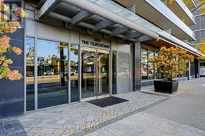 Toronto (Islington-City Centre West) condo for rent - The Queensway storefront with glass doors and windows.