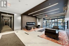 Toronto (Islington-City Centre West) condo for rent - A spacious lobby with a reception desk and seating area.