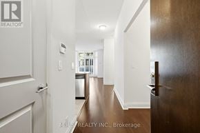 Toronto (Islington-City Centre West) condo for rent - A hallway with a white door and a brown door.