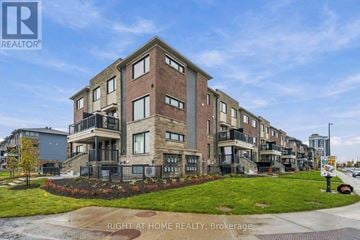 Ottawa townhouse for rent - A building with the text "RIGHT AT HOME REALTY, Brokerage" in front of it.