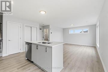 Ottawa townhouse for rent - A kitchen area with a sink and cabinets.