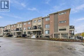 Ottawa townhouse for rent - A building complex with the text "RIGHT AT HOME REALTY, Brokerage" on the bottom.