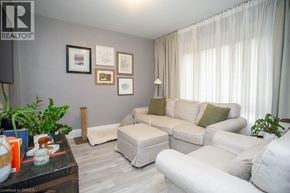 Brantford apartment for rent - A living room with a white couch and a coffee table.