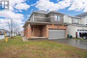 Ottawa apartment for rent - A house with a grey roof and a brick chimney is for sale.