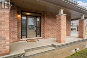 Ottawa apartment for rent - A brick house with a glass door and a doormat that says "welcome".