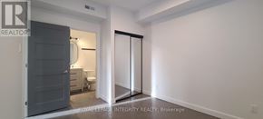 Ottawa multi-family for rent - A bedroom with a toilet and a wardrobe.