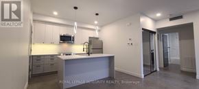 Ottawa multi-family for rent - A kitchen with a sink and a microwave.