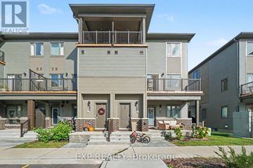 Ottawa townhouse for rent - Apartment complex with a bicycle parked in front.