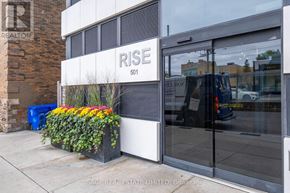 Toronto (Casa Loma) condo for rent - A building with a sign that says "RISE" on it.