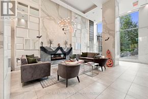 Toronto (Casa Loma) condo for rent - A living room with a fireplace and a chandelier.