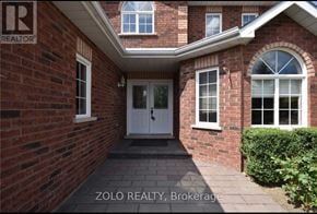 Barrie (Georgian Drive) apartment for rent - A brick house with a white door and windows.