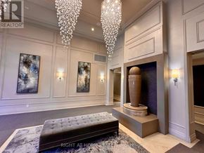 Toronto (Edenbridge-Humber Valley) condo for rent - A living room with a chandelier, a fireplace, and a bench.