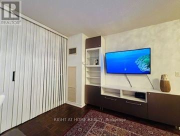 Toronto (Edenbridge-Humber Valley) condo for rent - A living room with a television and a rug on the floor.