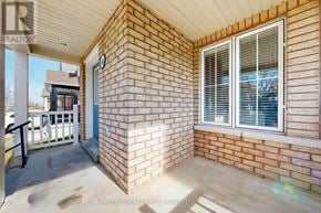 Ajax (Northeast Ajax) apartment for rent - A brick house with a white door and window.