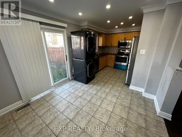 Brampton (Northwest Sandalwood Parkway) apartment for rent - A kitchen with tile flooring and a refrigerator.