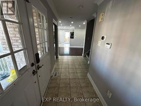Brampton (Northwest Sandalwood Parkway) apartment for rent - A hallway with a door on the left and a wall on the right.