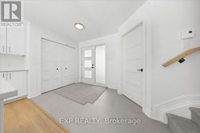 Casselman townhouse for rent - A hallway with a carpeted area and a skateboard on the wall.