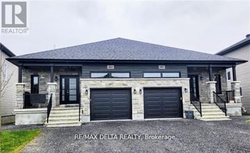 Russell apartment for rent - A two-story house with a garage is for sale in Brokerage.