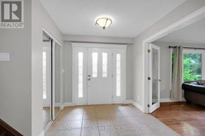 Ottawa apartment for rent - A white door with a glass panel is in the middle of a hallway.