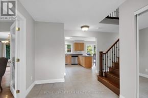 Ottawa apartment for rent - A spacious living room with a staircase leading to the upper floor.