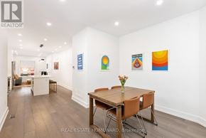 Toronto (Trinity-Bellwoods) duplex for rent - A dining room with a wooden table and chairs.