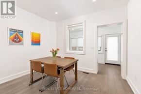 Toronto (Trinity-Bellwoods) duplex for rent - A dining room with a wooden table and chairs.
