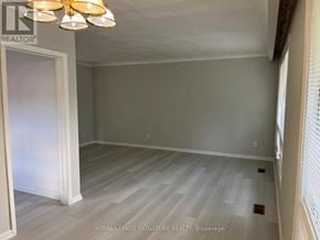 Toronto (Tam O'shanter-Sullivan) apartment for rent - A room with a white door and a chandelier.