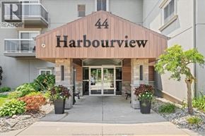 Leamington condo for rent - The entrance to a building named Harbourview with a number 44 on it.