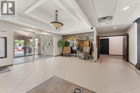 Leamington condo for rent - A realtor office with a white ceiling and a black door.