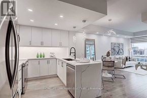 Markham (Unionville) condo for rent - A modern kitchen with white cabinets and a marble island.
