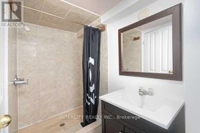 Toronto (Kingsview Village-The Westway) multi-family for rent - A bathroom with a shower, sink, and mirror.