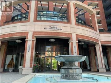 Toronto (Yorkdale-Glen Park) condo for rent - A building with a fountain in front of it.