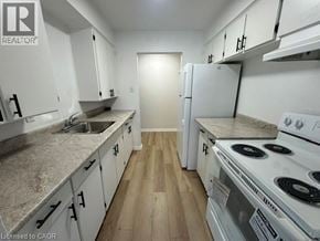 Kitchener apartment for rent - A kitchen with white appliances and cabinets.