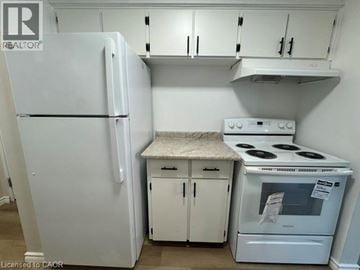 Kitchener apartment for rent - A white refrigerator and stove in a kitchen.