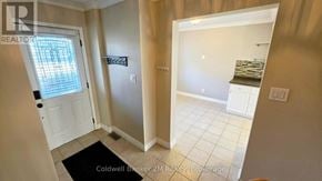 Oshawa (Pinecrest) apartment for rent - A brokerage office with a door and a window.