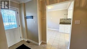 Oshawa (Pinecrest) apartment for rent - A room with a white door and a window with blinds.