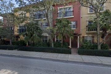 Lake Worth Beach apartment for rent - A row of apartment buildings with trees in front.