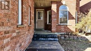 Newmarket (Gorham-College Manor) apartment for rent - A brick house with a brown door and a window.