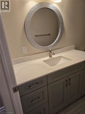 Cambridge apartment for rent - A bathroom with a sink and a mirror.