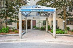 Guelph (Willow West/Sugarbush/West Acres) condo for rent - The entrance to Parkview West is framed by trees and landscaping.