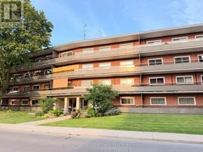 Hamilton (Corman) condo for rent - A multi-story apartment building with balconies and windows.