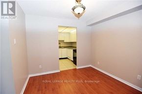 Mississauga (Cooksville) condo for rent - A room with wooden floors and a chandelier.