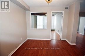 Mississauga (Cooksville) condo for rent - A room with wooden floors and white walls.